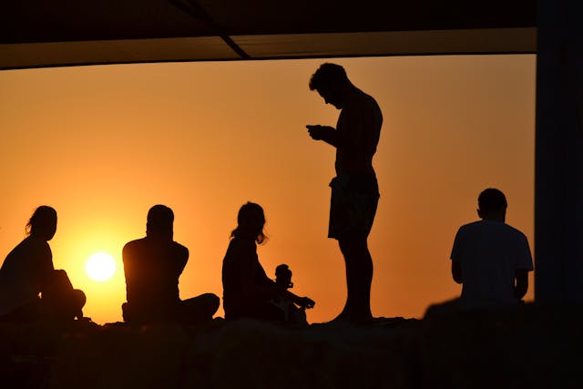 friends hanging out sunset